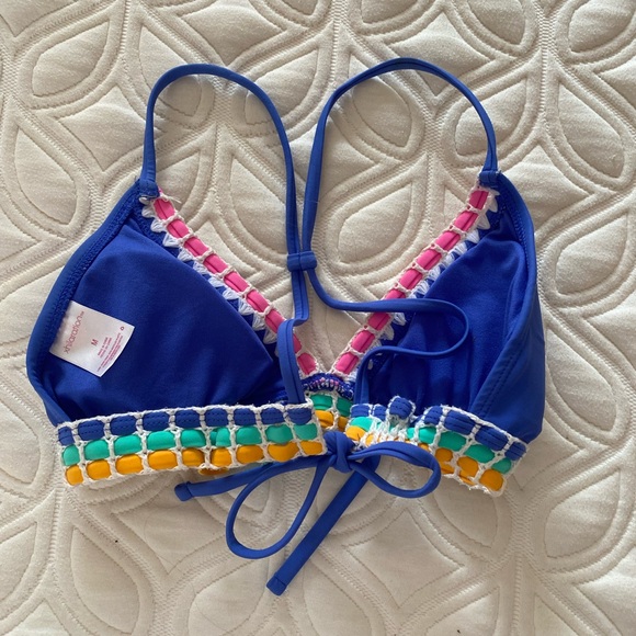 Blue bikini top with pink green and yellow detailing lacing. - Picture 2 of 3